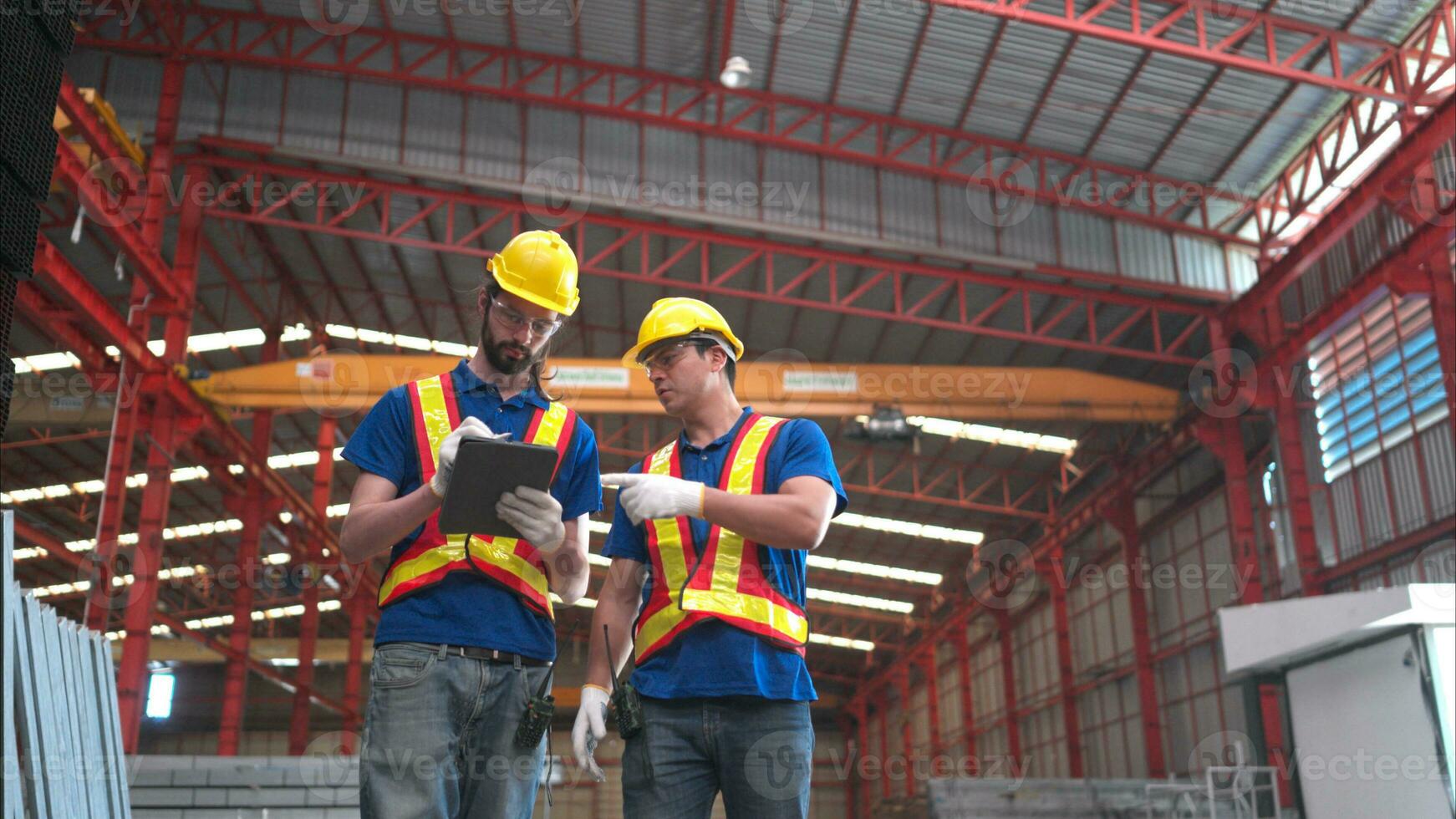 Warehouse workers in hard hats and helmets, Inspect and count steel in