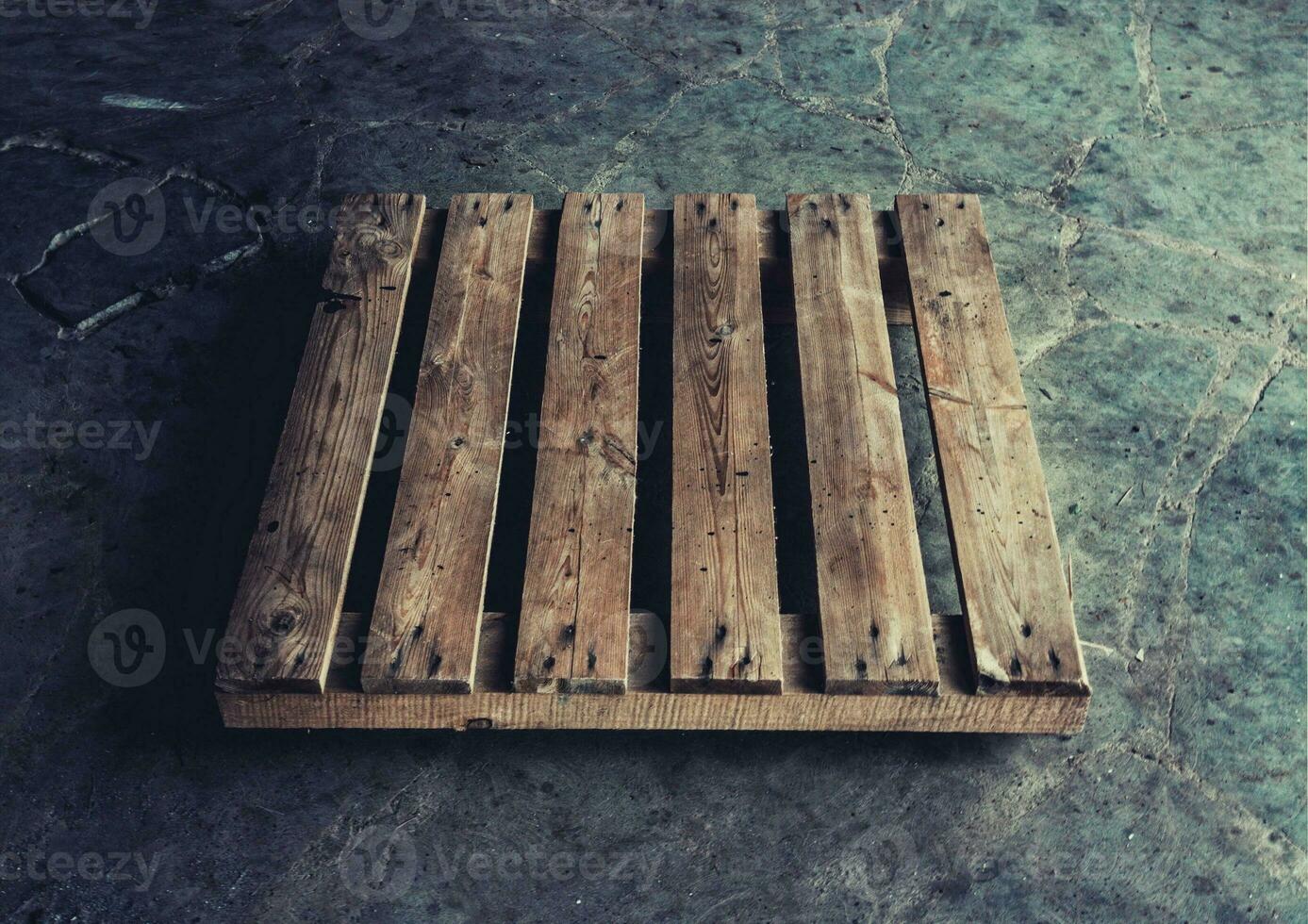 Wooden palette closeup on floor photo