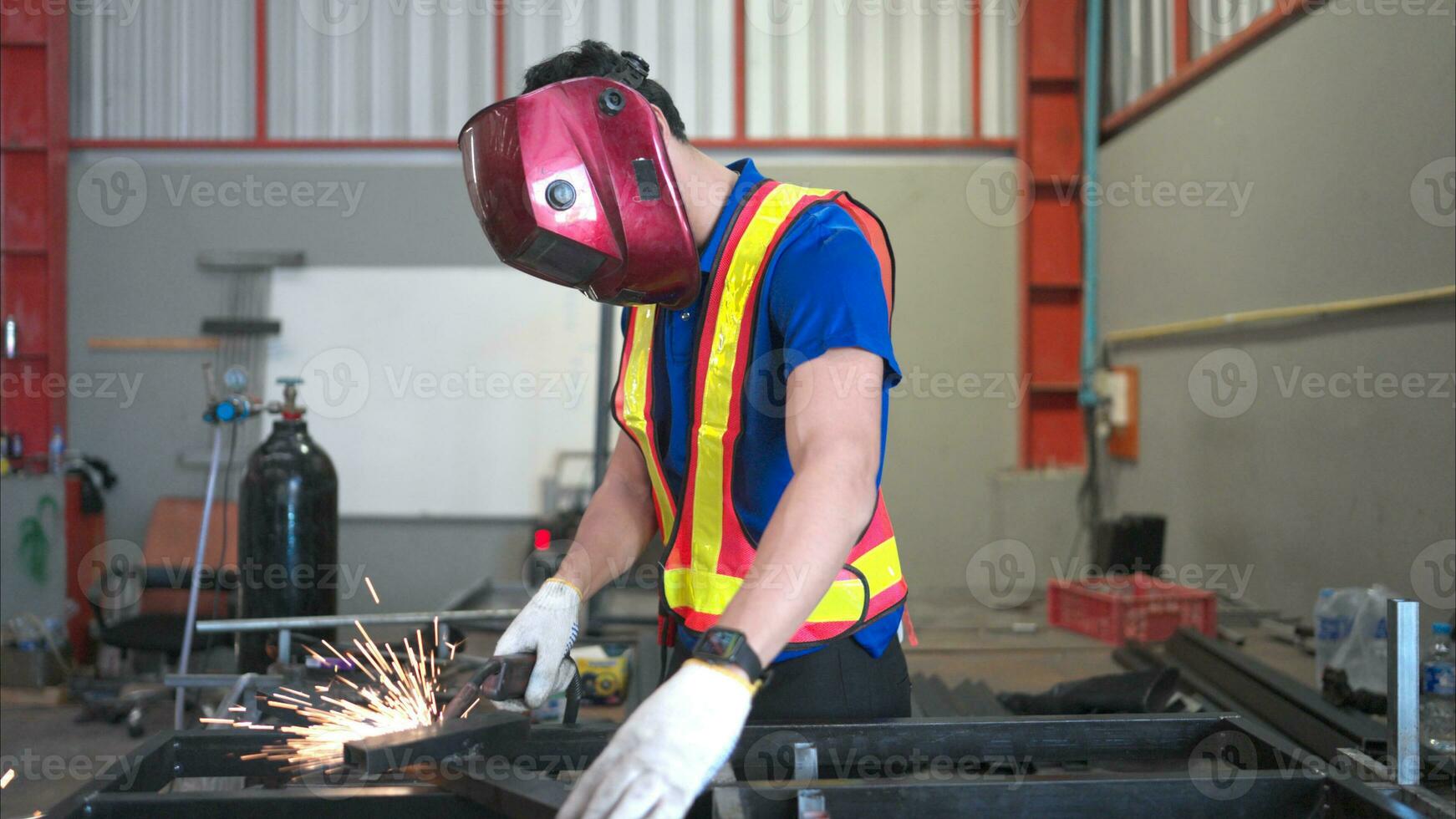 Warehouse worker wear hard hats to protect from welding glare, Welding steel parts of a building structure in a factory photo