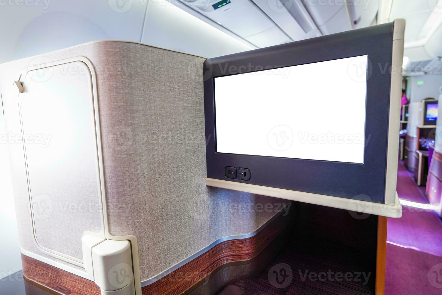 Monitor screen of business seat on cabin photo