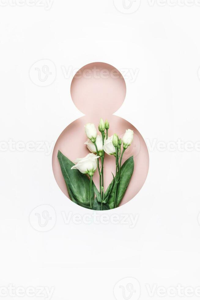 marzo 8vo concepto. número 8 hecho de agujero y blanco flores elegante saludo tarjeta De las mujeres día en marzo 8vo foto
