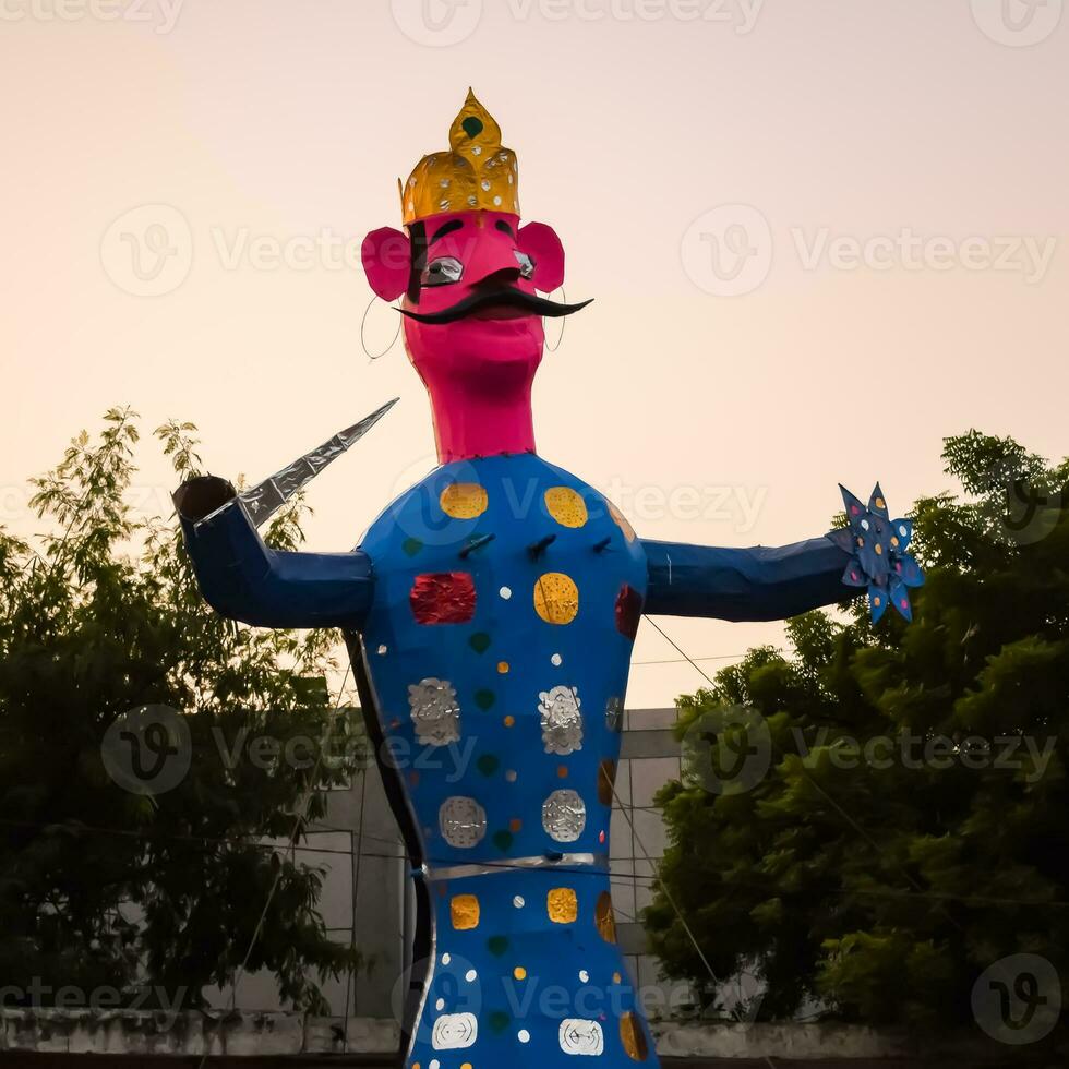 Ravnans being ignited during Dussera festival at ramleela ground in Delhi, India, Big statue of Ravana to get fire during the Fair of Dussera to celebrate the victory of truth by Lord Rama photo