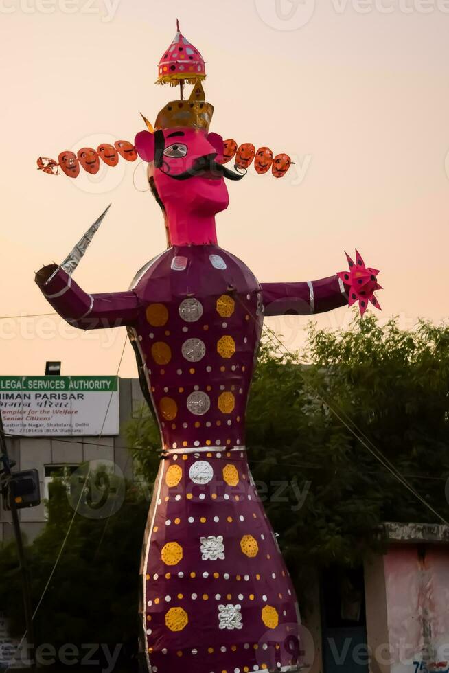 Ravnans being ignited during Dussera festival at ramleela ground in Delhi, India, Big statue of Ravana to get fire during the Fair of Dussera to celebrate the victory of truth by Lord Rama photo