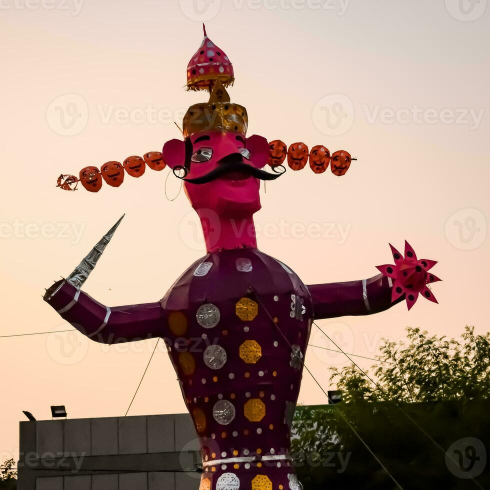 Ravnans being ignited during Dussera festival at ramleela ground in Delhi, India, Big statue of Ravana to get fire during the Fair of Dussera to celebrate the victory of truth by Lord Rama photo