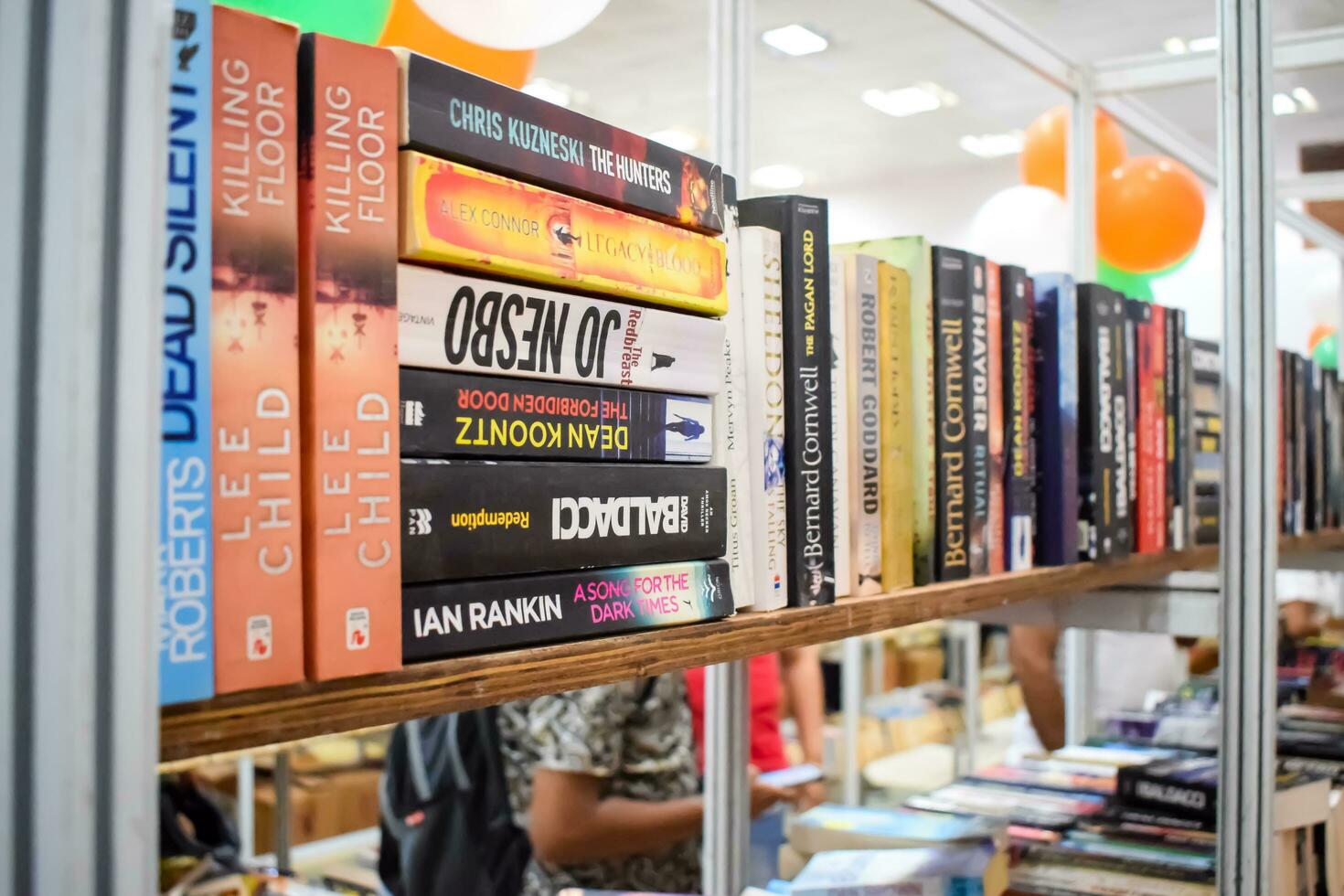 New Delhi, India, September 09 2023 - Variety of Books on shelf inside a book-stall at Delhi International Book Fair, Selection of books on display in Annual Book Fair. photo