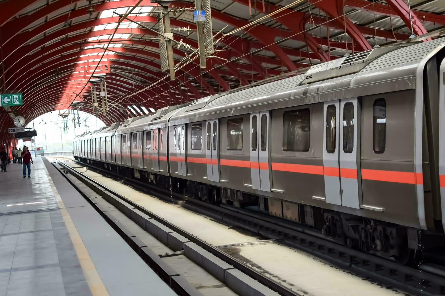 New Delhi India - October 09 2023 - Delhi Metro train arriving at Jhandewalan metro station in New Delhi, India, Asia, Public Metro departing from Jhandewalan station photo