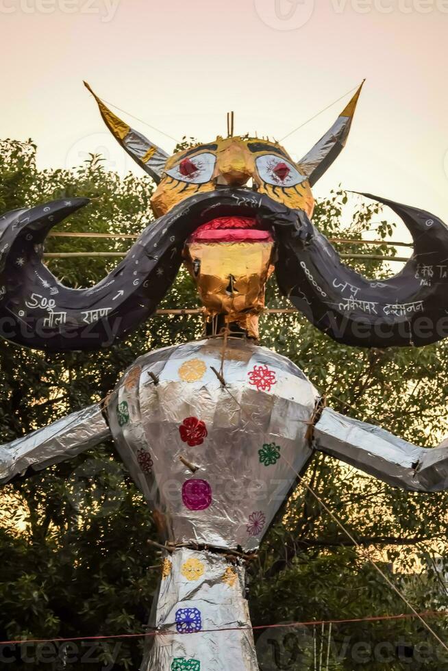 Ravnans being ignited during Dussera festival at ramleela ground in Delhi, India, Big statue of Ravana to get fire during the Fair of Dussera to celebrate the victory of truth by Lord Rama photo