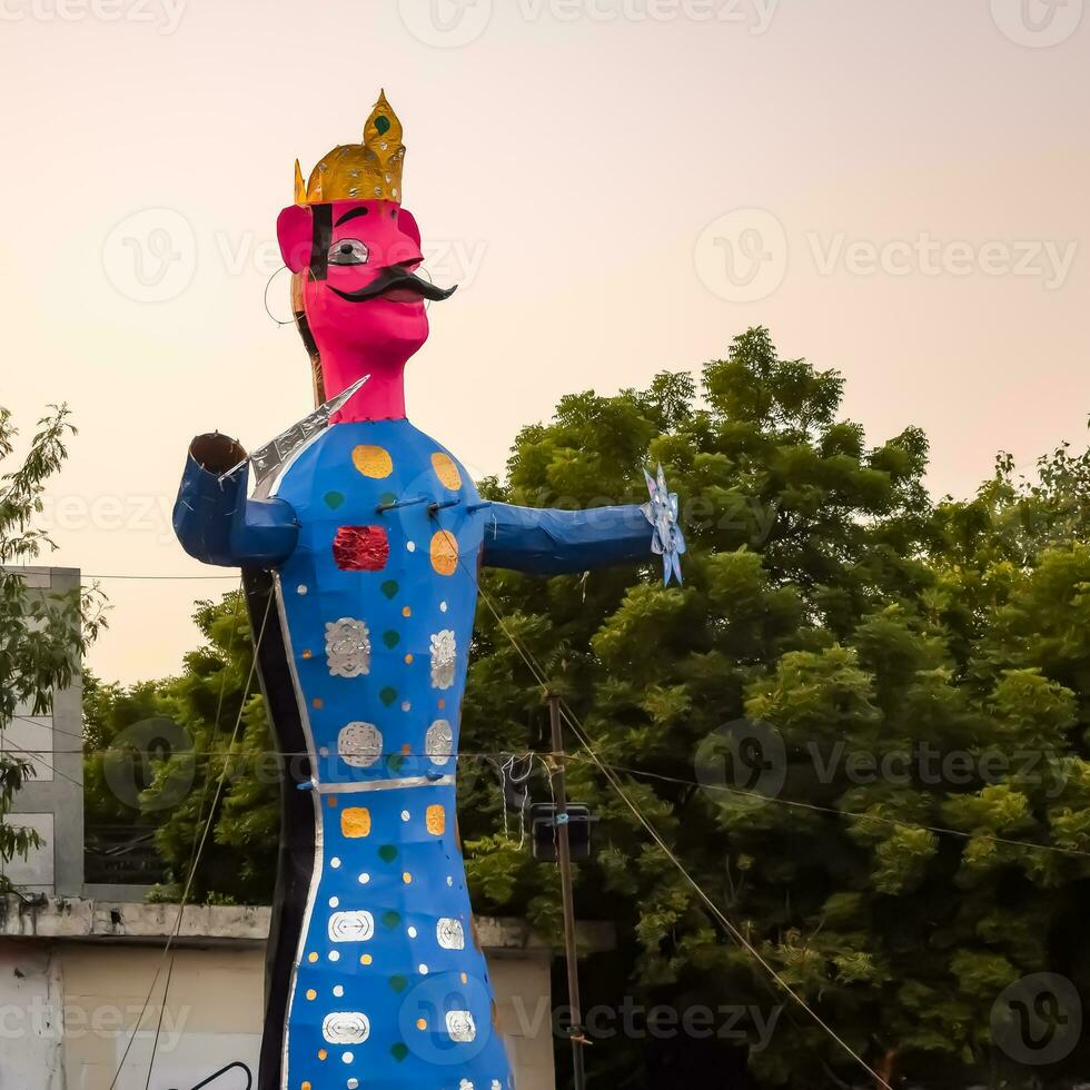 Ravnans being ignited during Dussera festival at ramleela ground in Delhi, India, Big statue of Ravana to get fire during the Fair of Dussera to celebrate the victory of truth by Lord Rama photo