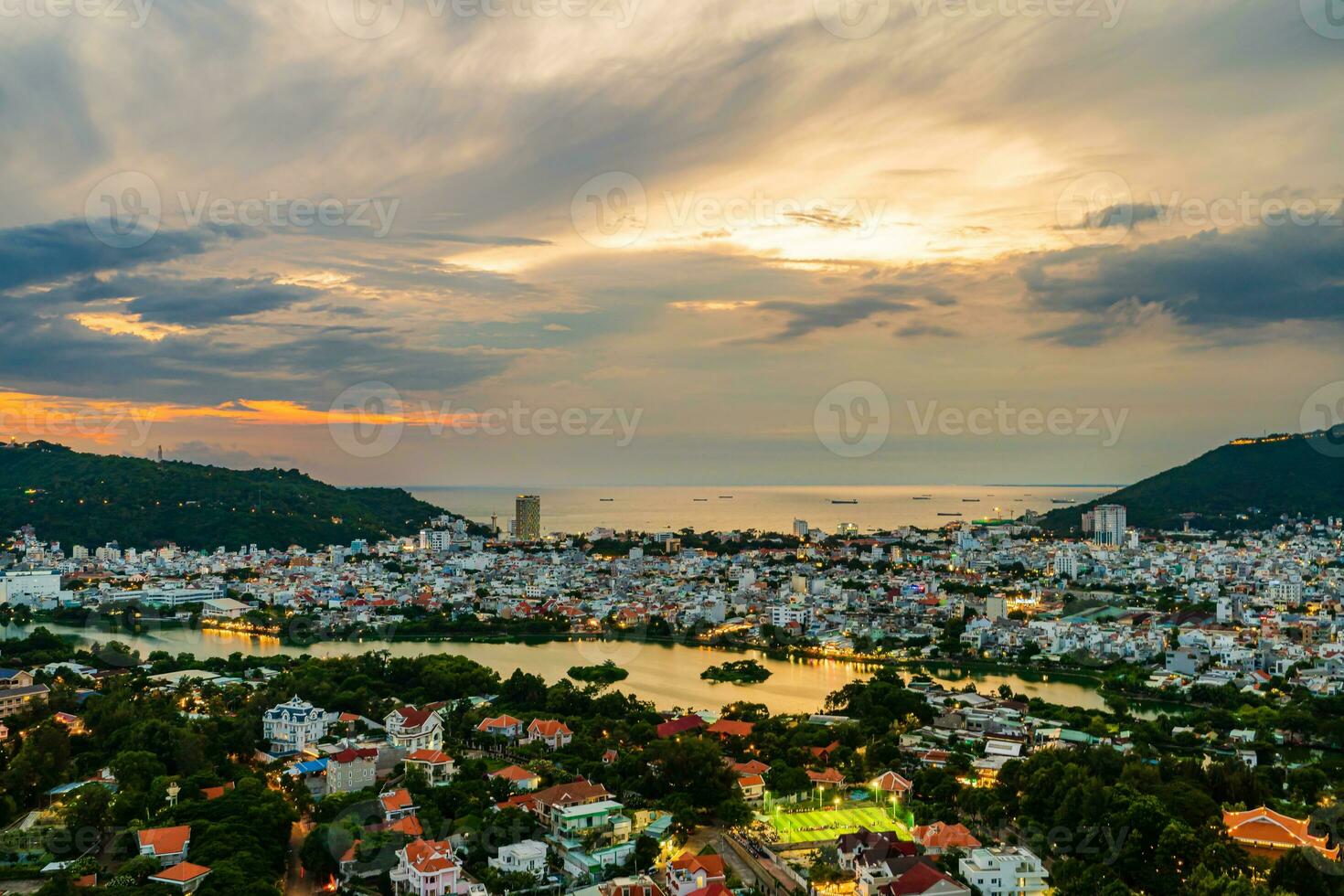 Sunset in Vung Tau city and coast, Vietnam. Vung Tau is a famous coastal city in the South of Vietnam photo
