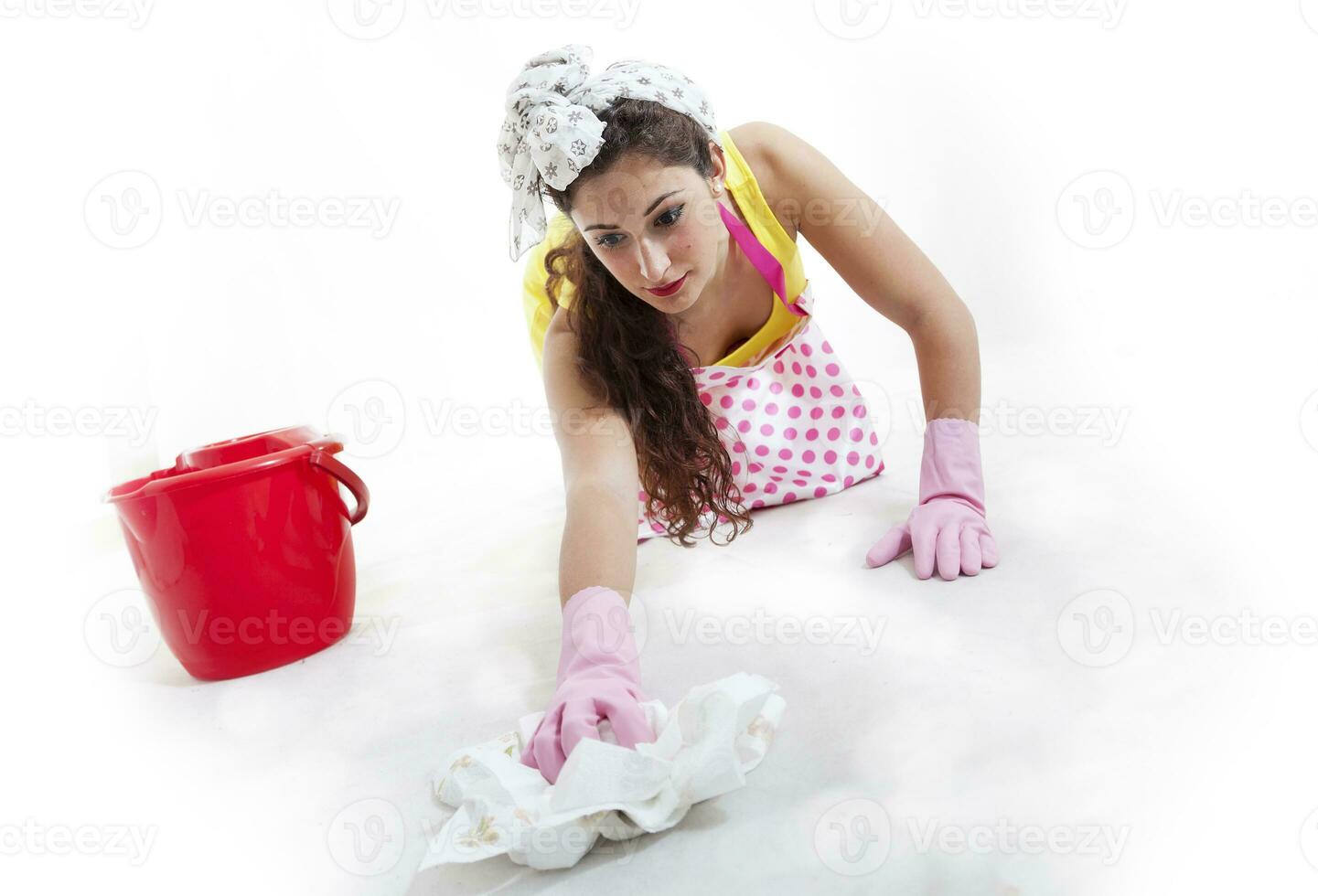 pretty woman with cloth and bucket cleaning the floor photo