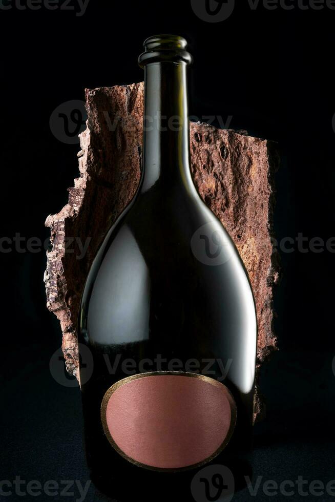 bottle of champagne with blank label in a bark photo