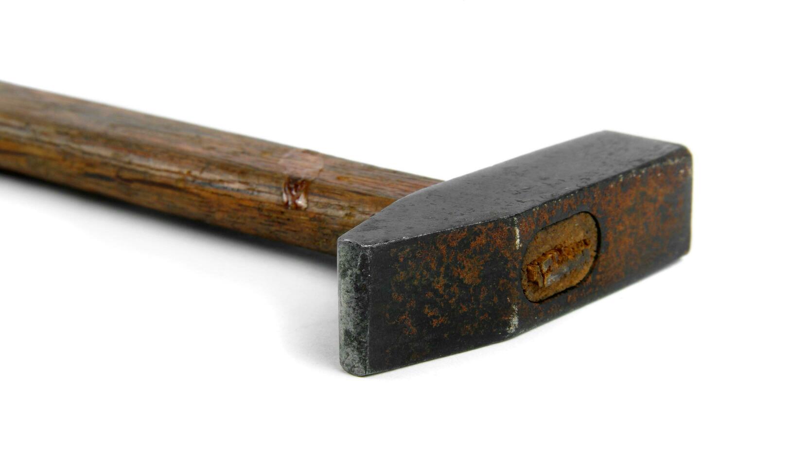 rusty hammer on white photo