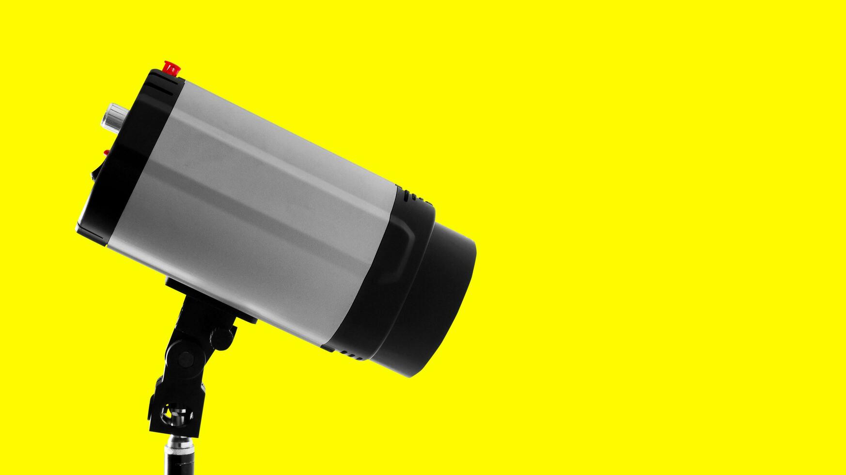Studio strobe flash on the yellow photo