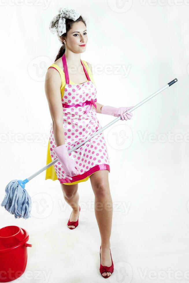 cleaning lady dreams of playing guitar with the broom handle photo