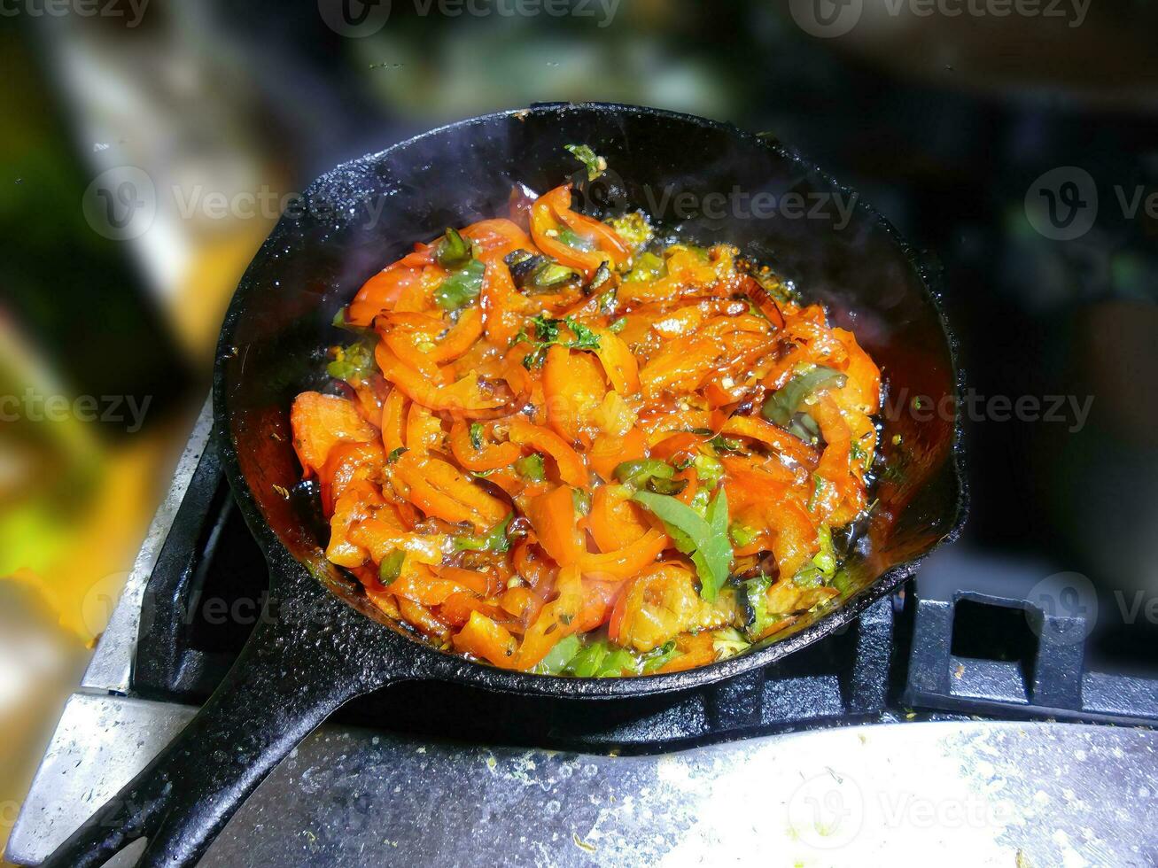 Saute of red bell pepers and jalapenos photo