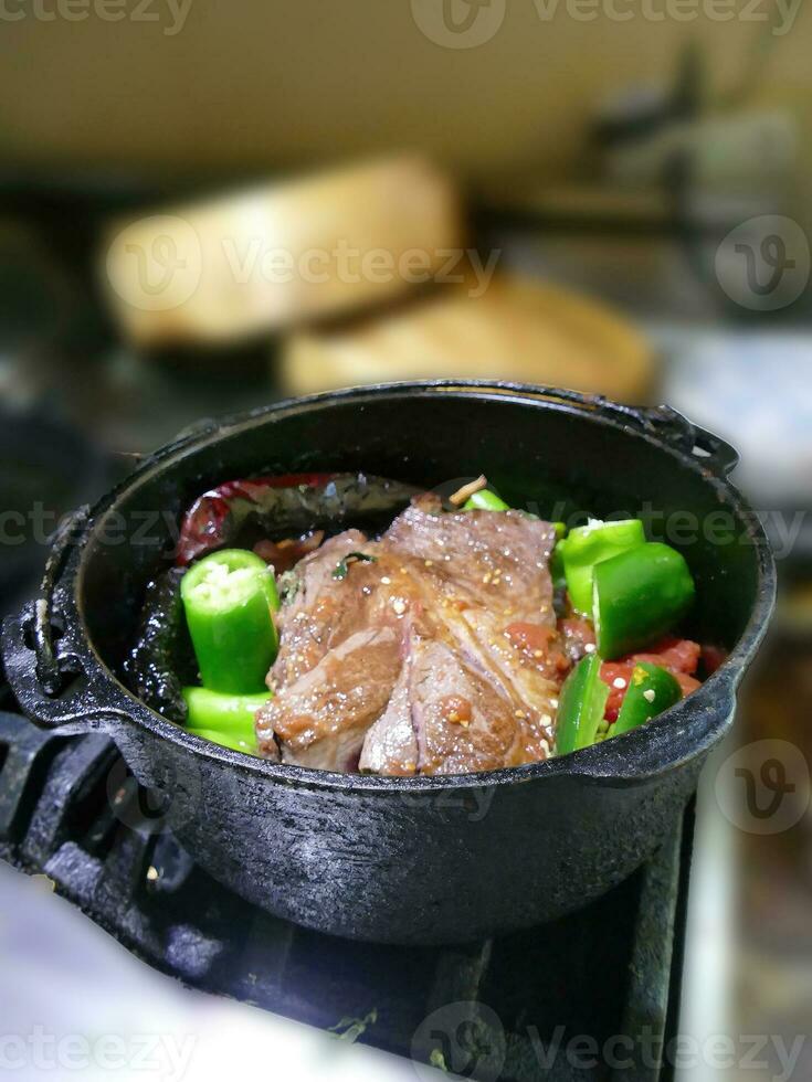 Braised beef pot roast with  jalapenos and Mexican chilis photo