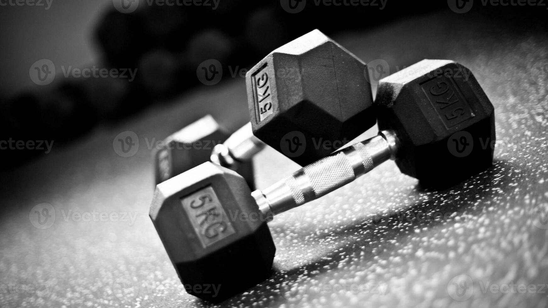 Isolated Dumbbell Concept. Fitness Equipment for Gym Workout, Strength Training, Bodybuilding, and Powerlifting photo