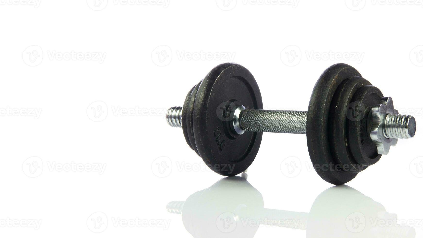 Isolated Dumbbell Concept. Fitness Equipment for Gym Workout, Strength Training, Bodybuilding, and Powerlifting photo