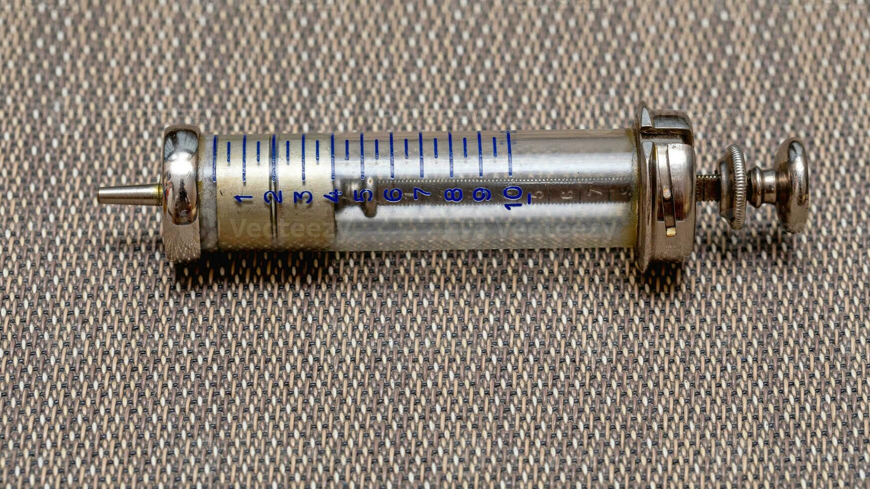 Vintage Glass Syringe, Nostalgic Medical Relic isolated photo