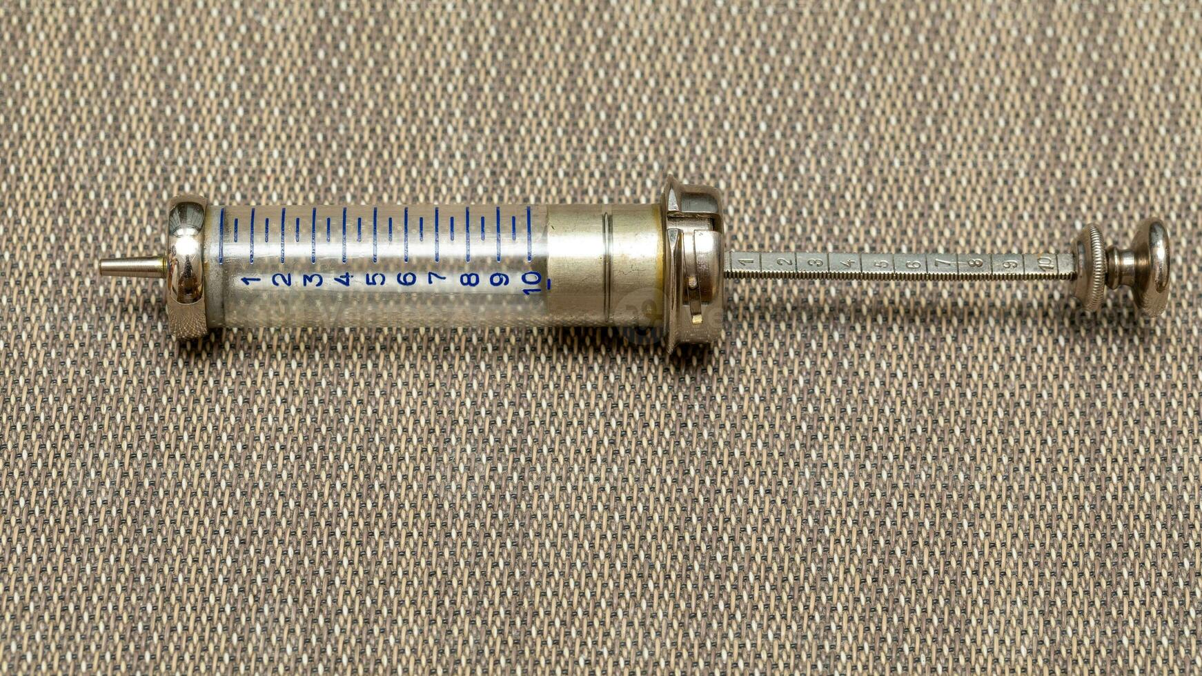 Vintage Glass Syringe, Nostalgic Medical Relic isolated photo