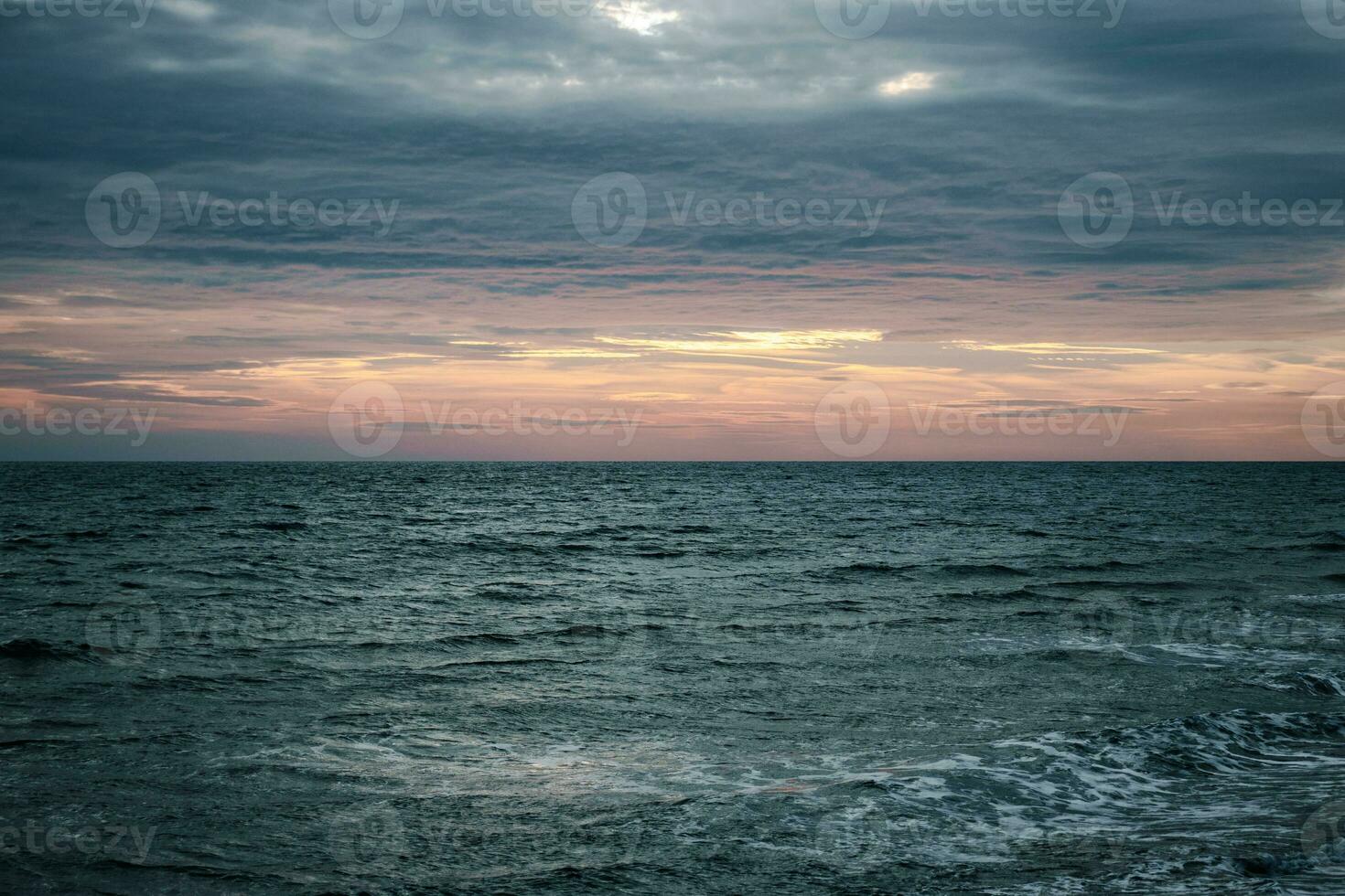 Winter Mediterranean sea waves landscape photo. Peaceful sunset time. Calm waves during vacation. photo