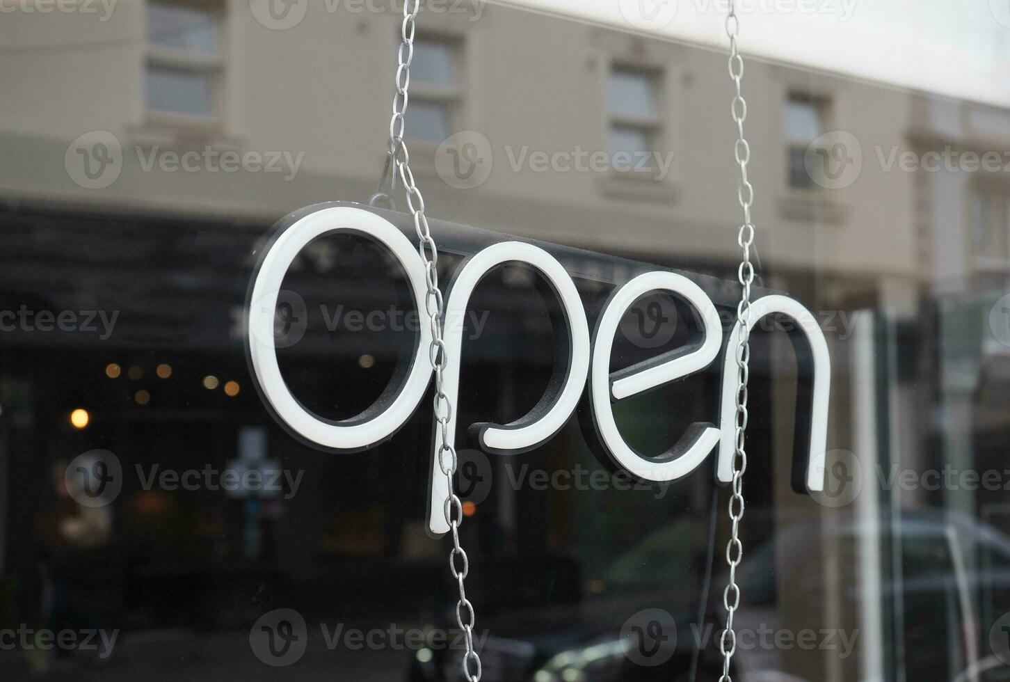 open sign in shop window photo