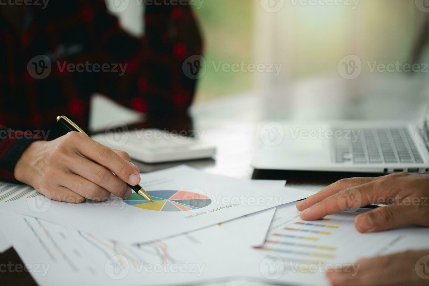 Business team. Analyze the results of marketing research or sales statistics in a briefing meeting with colleagues. photo