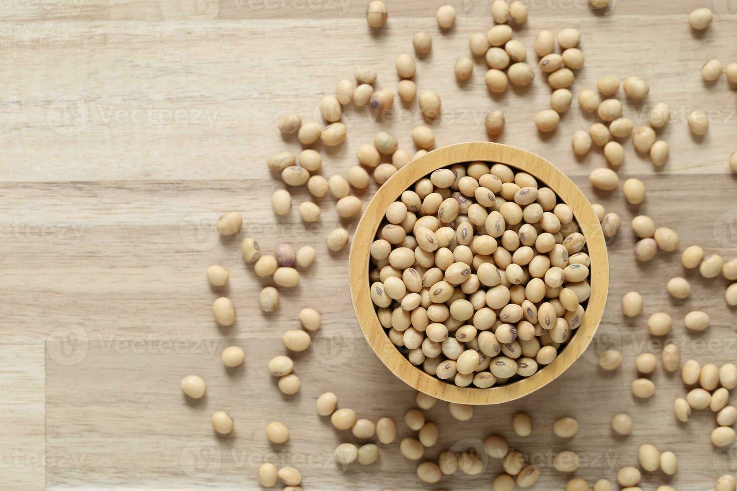 Top view of Soybeans in a bowl on wooder background, Healthy eating concept photo