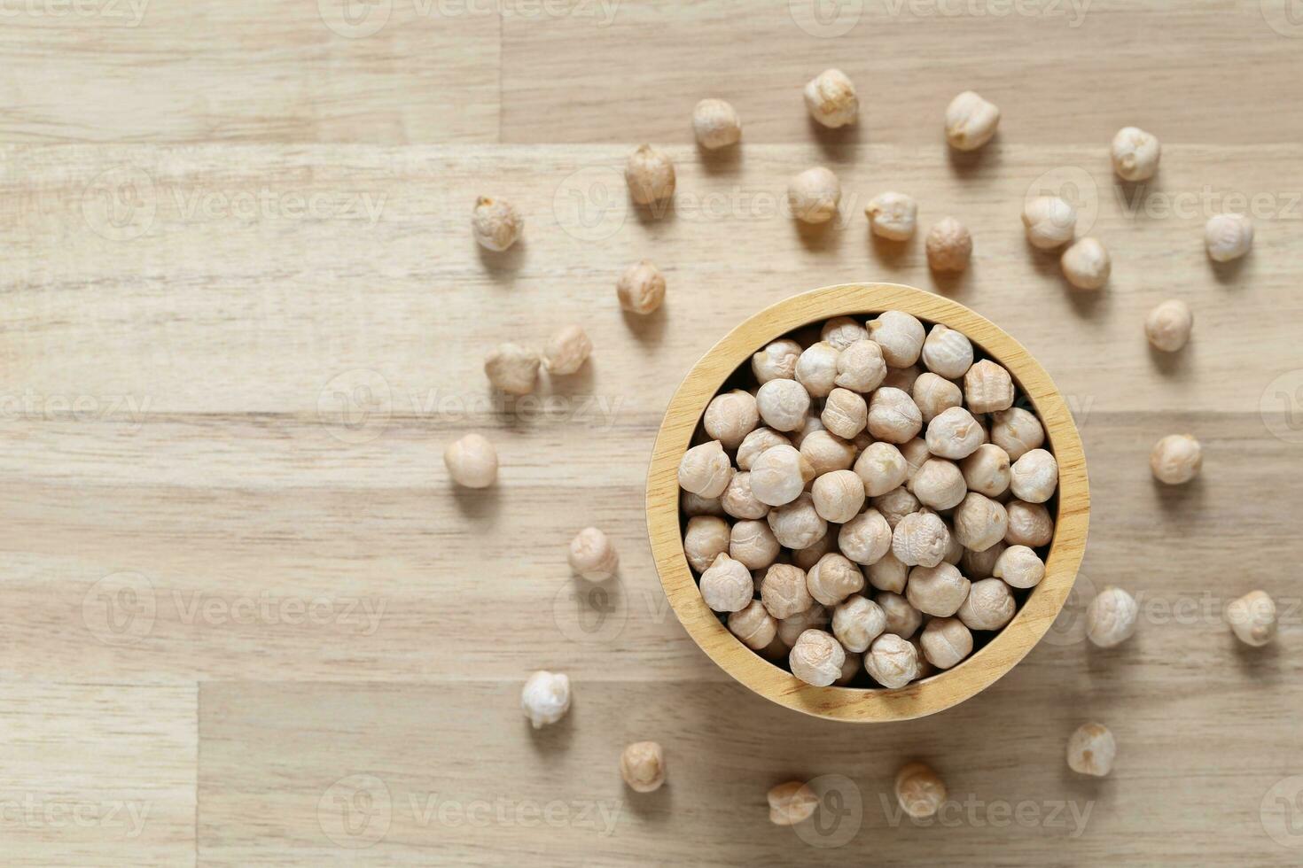 Top view of chick peas in a bowl on wooder background, Healthy eating concept photo