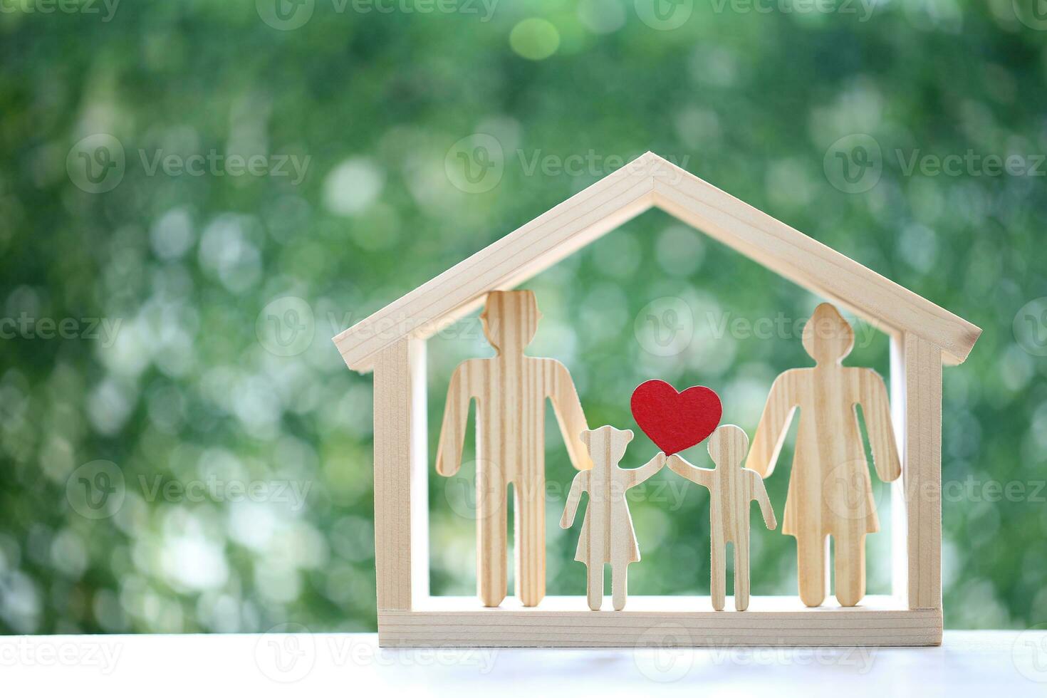 Model family in big house on natural green background,Save money for prepare in future and family finance concept photo