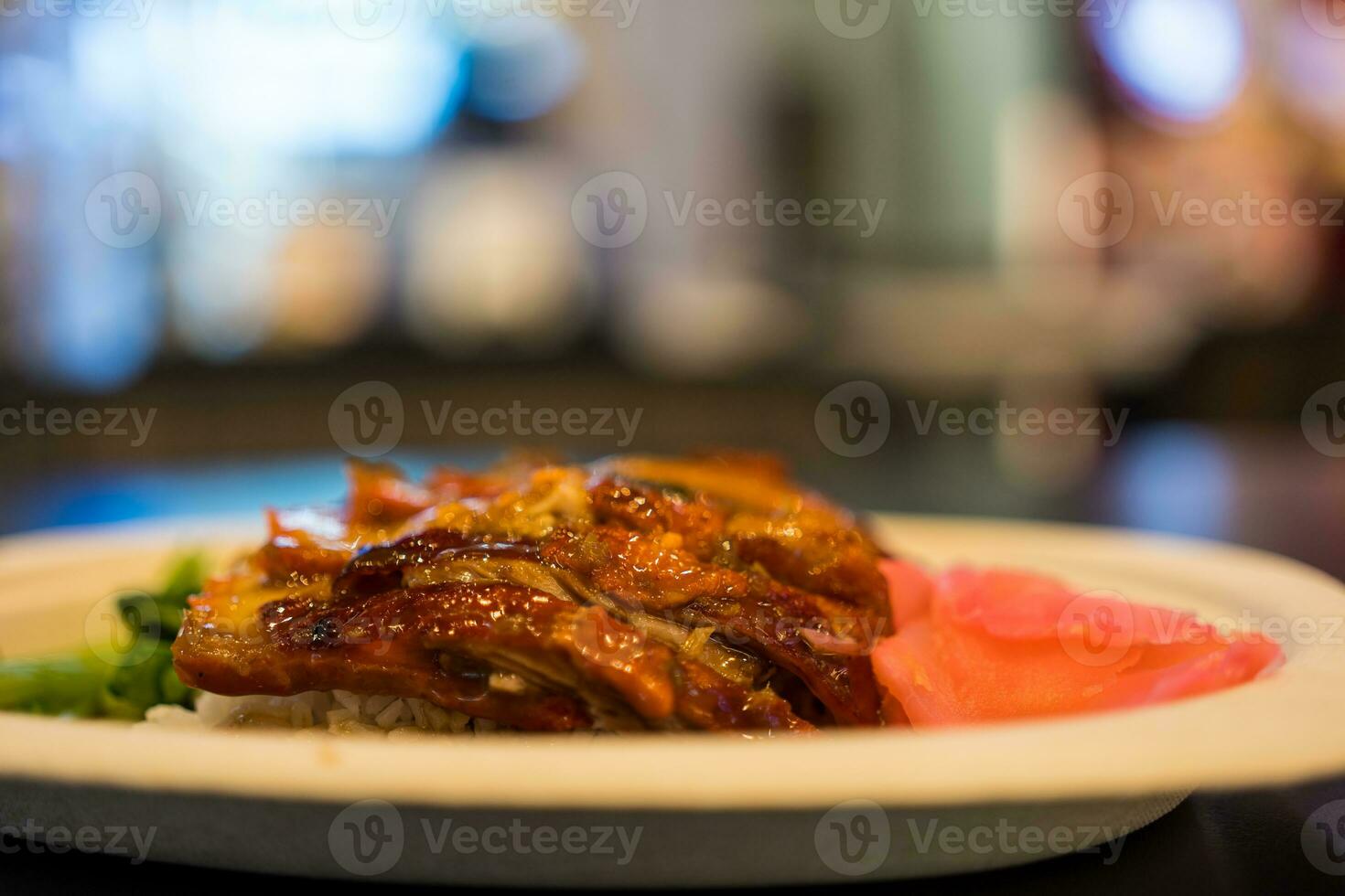 Grilled duck with cooked rice and pickled ginger photo