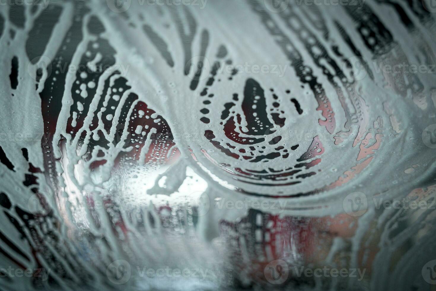 Close up shot of foam dripping from car. photo