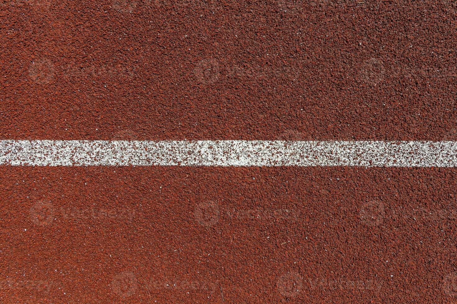 Sports surface, stadium running track. Background for motivation, striving forward. Copyspace photo