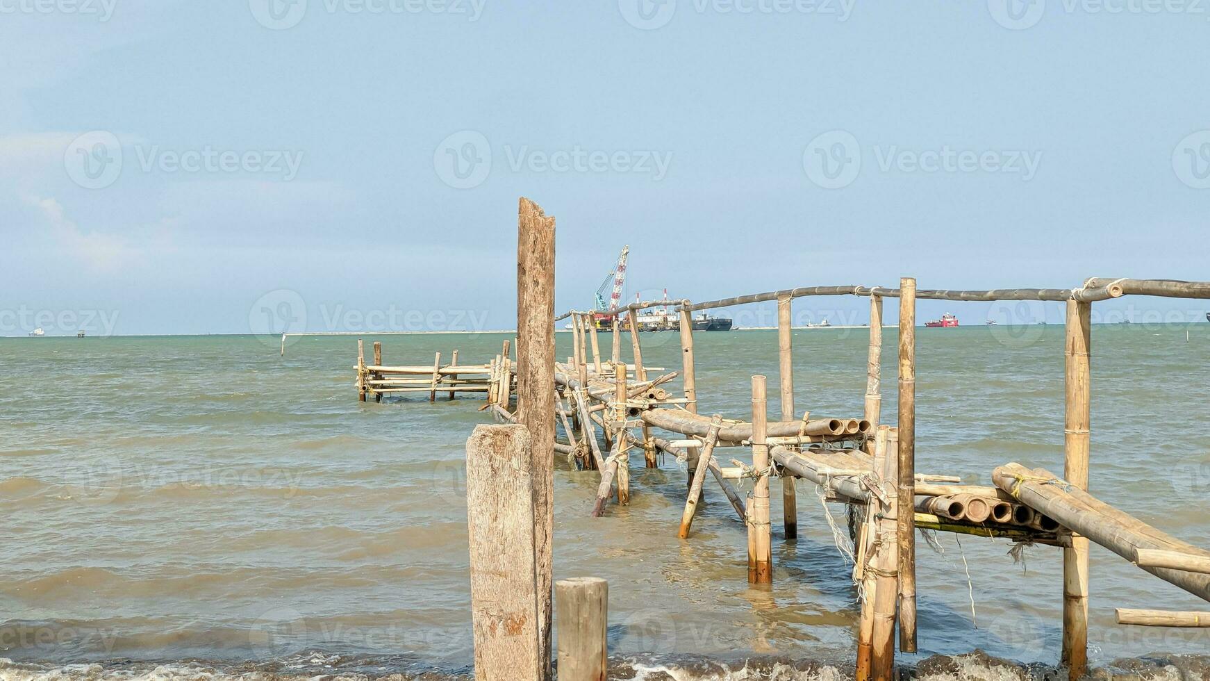 Wooden bridge in the sea, Indonesia, sea, blue sky photo