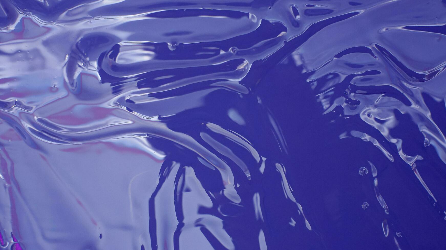 Shiny blue viscous liquid texture photo