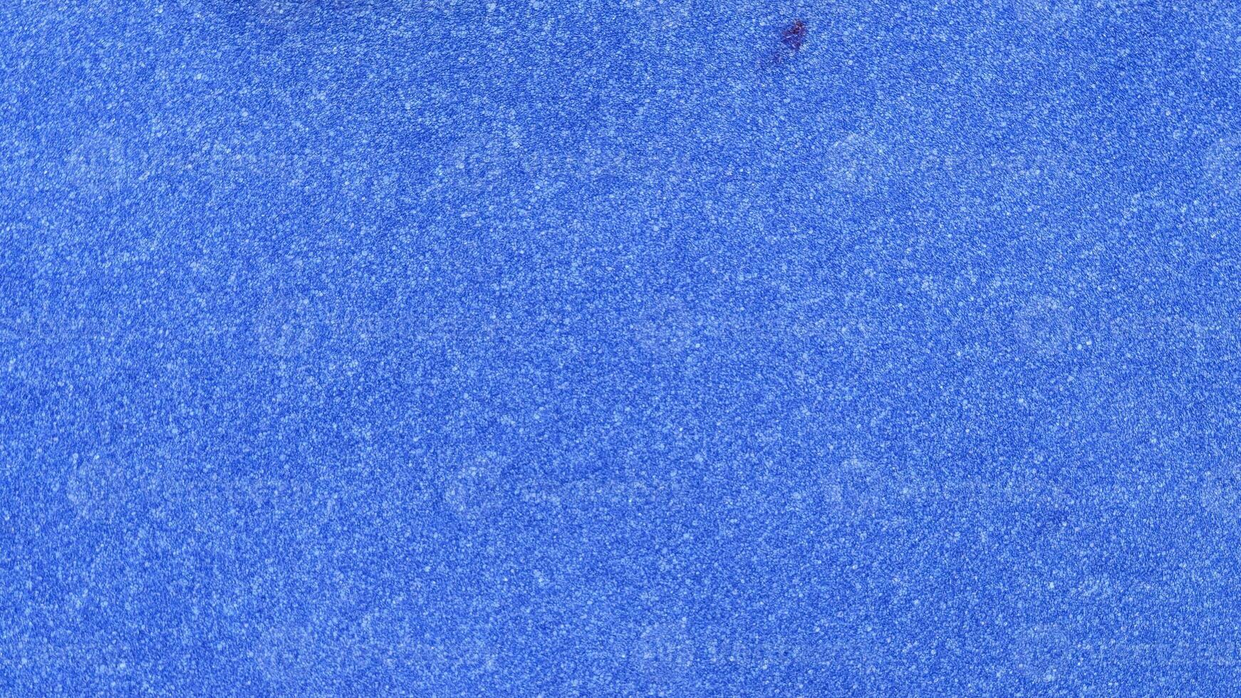 Blue paper texture or background. Blue paper sheet with copy space. photo