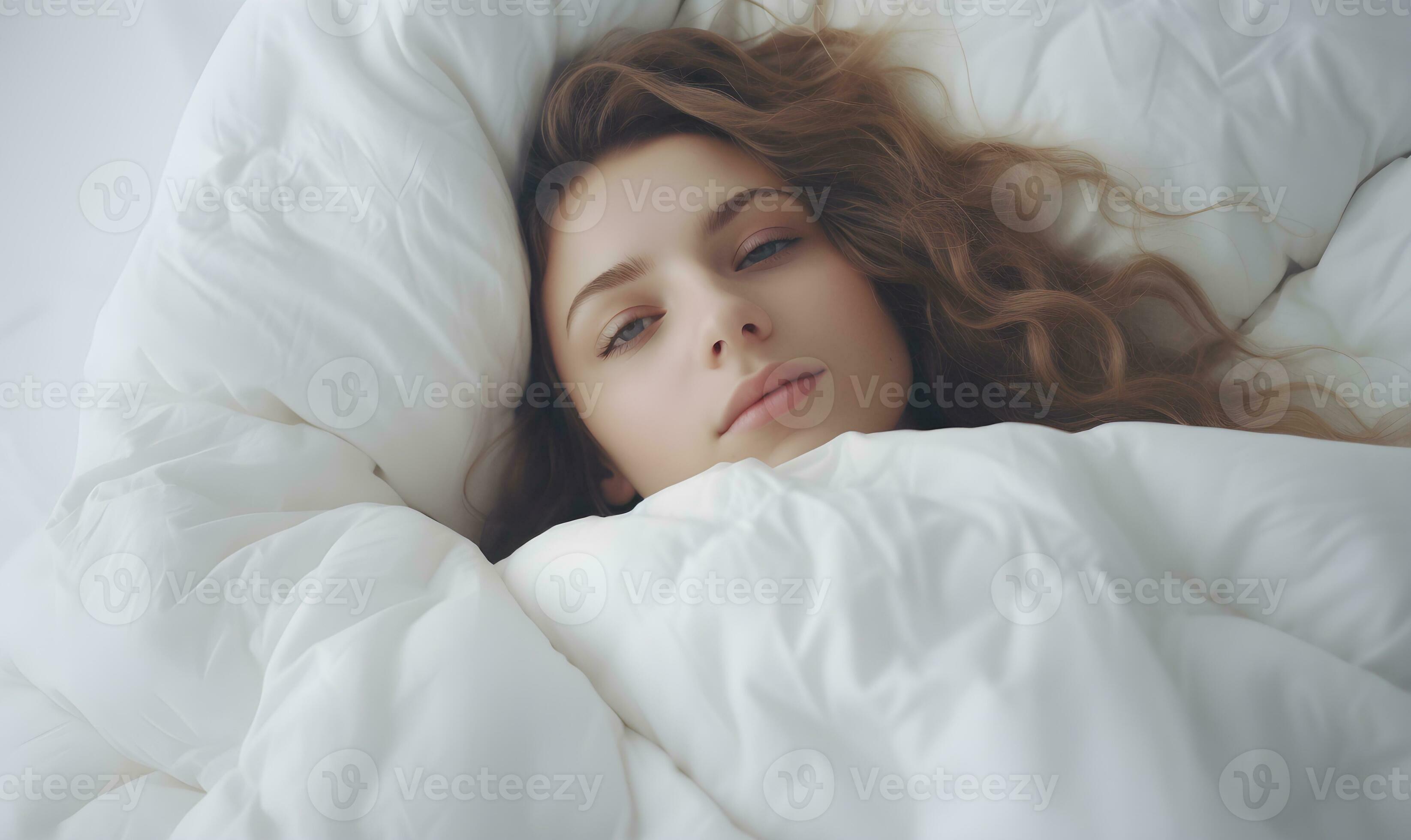 AI generated A young woman lies under a blanket. 36366415 Stock Photo