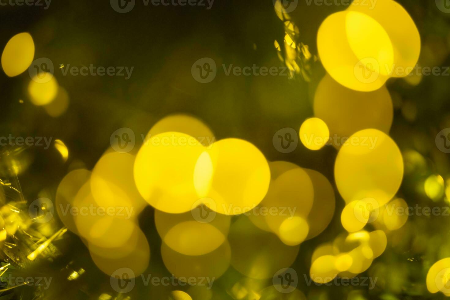Abstract background with Christmas or New Year festive sparkling light in the form of defocused bokeh photo