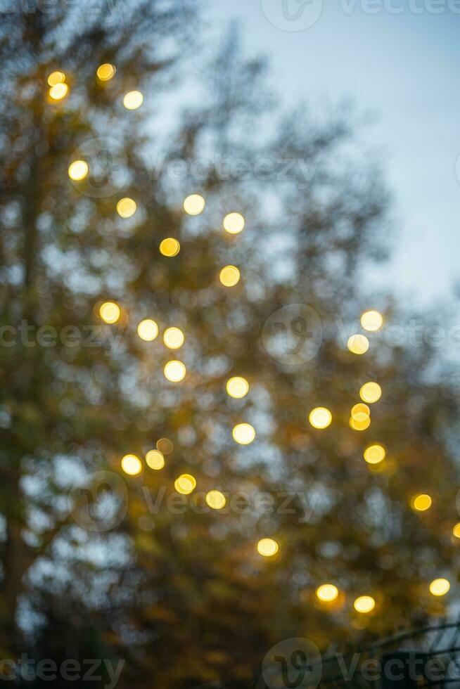 Light lamp festival or festive illuminated courtyard in the evening blur bokeh photo