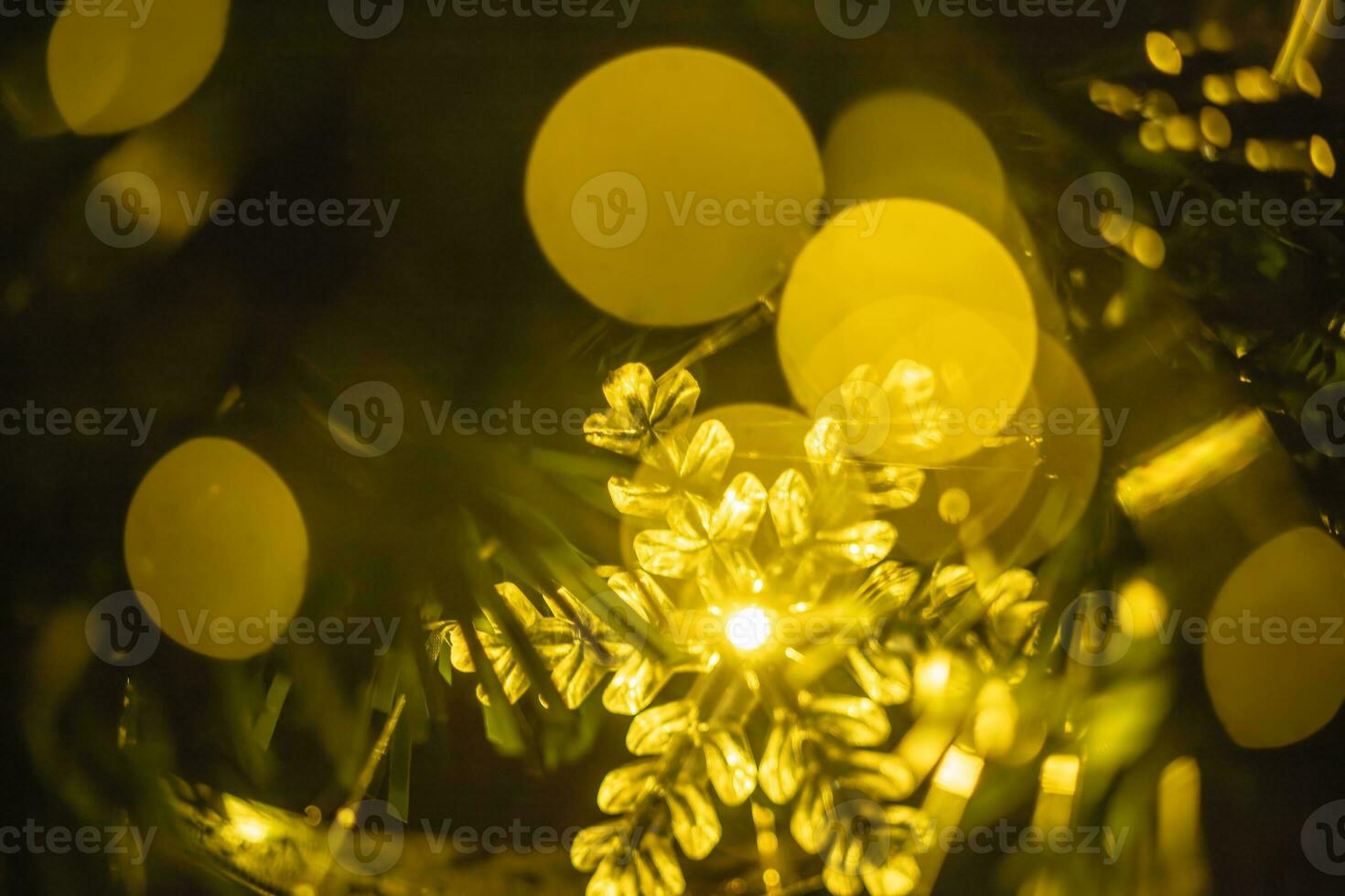 Abstract background with Christmas or New Year festive sparkling light in the form of defocused bokeh photo