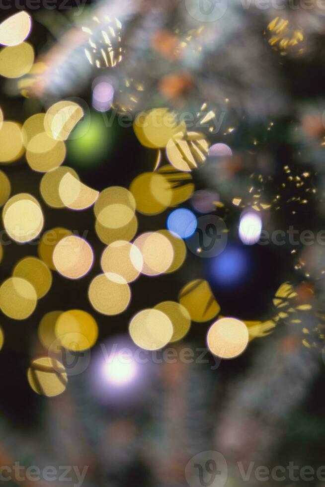Blurred Christmas and New Year theme background with glowing and sparkling elements photo