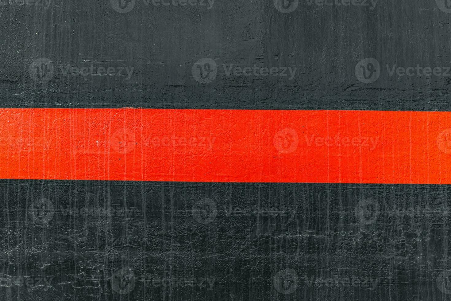 Textured painted metal with black base and red stripe for design photo