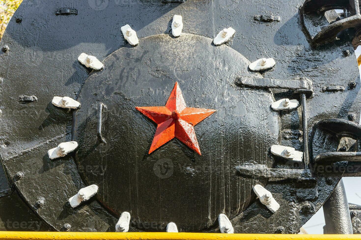 Red metal star on an iron base photo