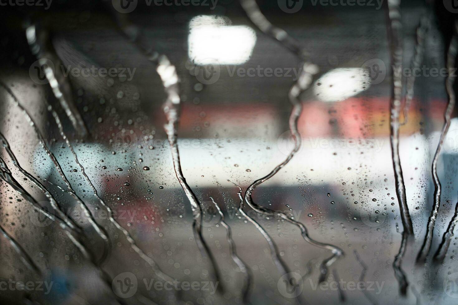 Car wash water on the windshield. View from inside. photo