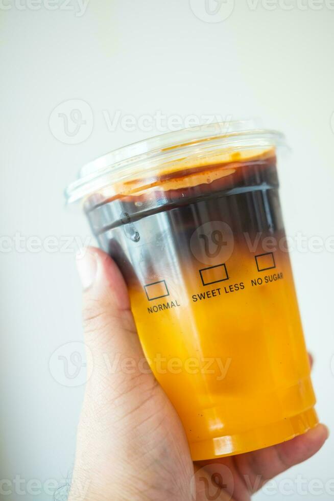 Coffee iced americano mix with orange juice photo