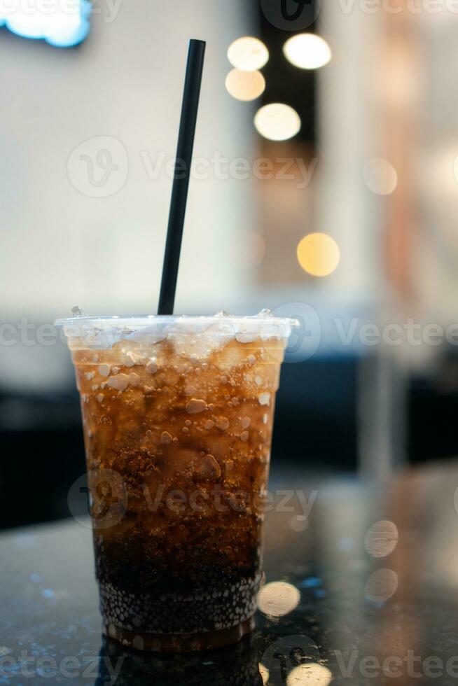 Cups of soft drinks in crushed ice with straw photo
