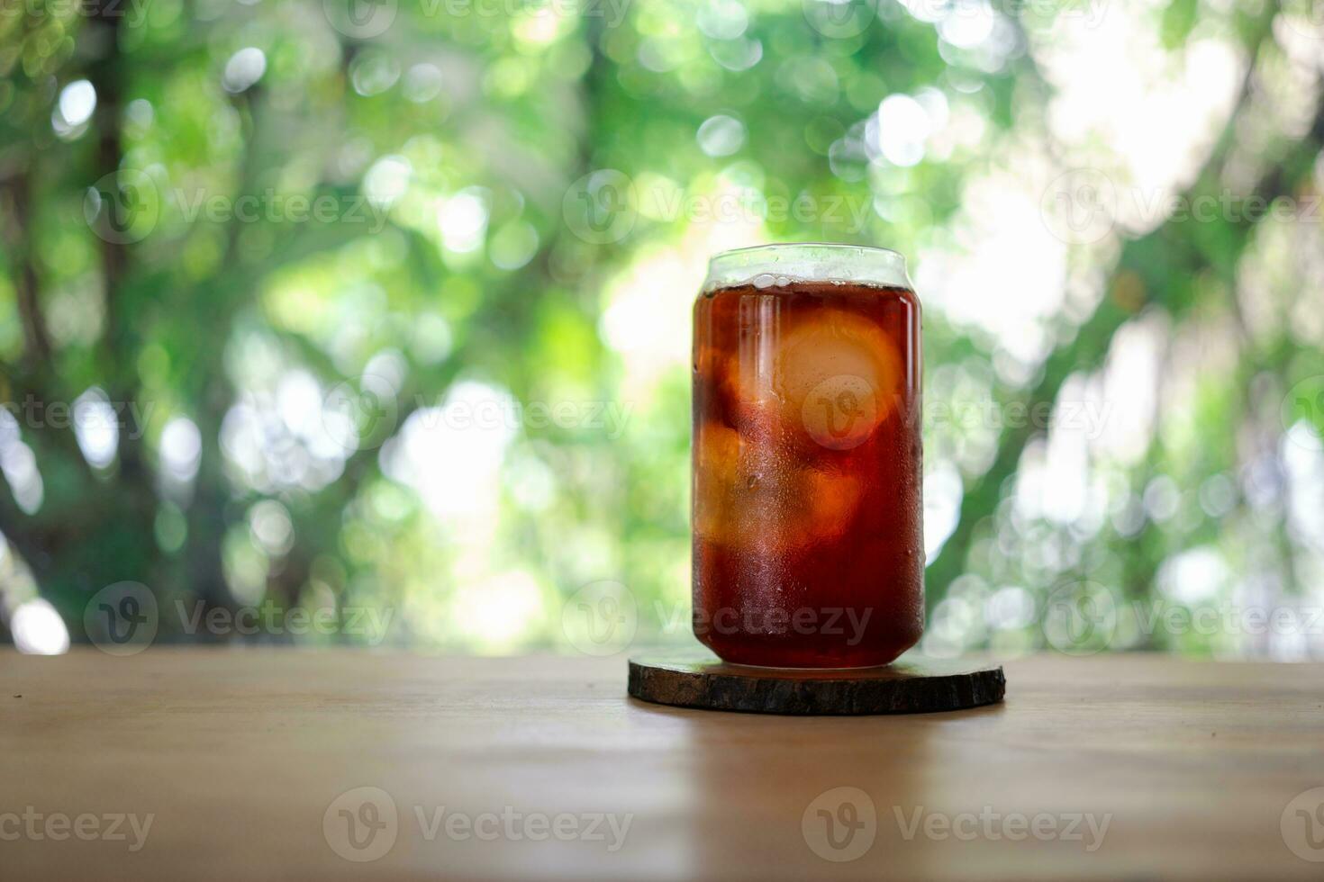 A glass of ice black coffee in coffee cafe photo