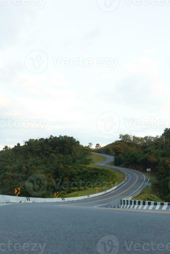 Beautiful curved road known as number 3 road on the high mountain along the way to Bo Kluea district in Nan province, Thailand. photo