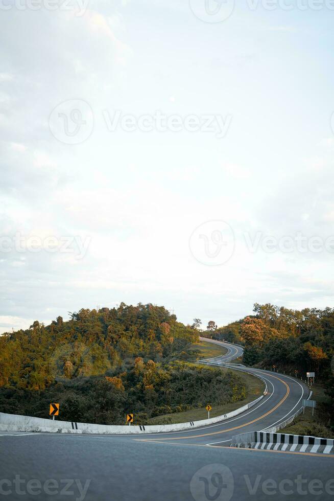 Beautiful curved road look like number 3 on the high mountain along the way to Bo Kluea district in Nan province, Thailand. photo