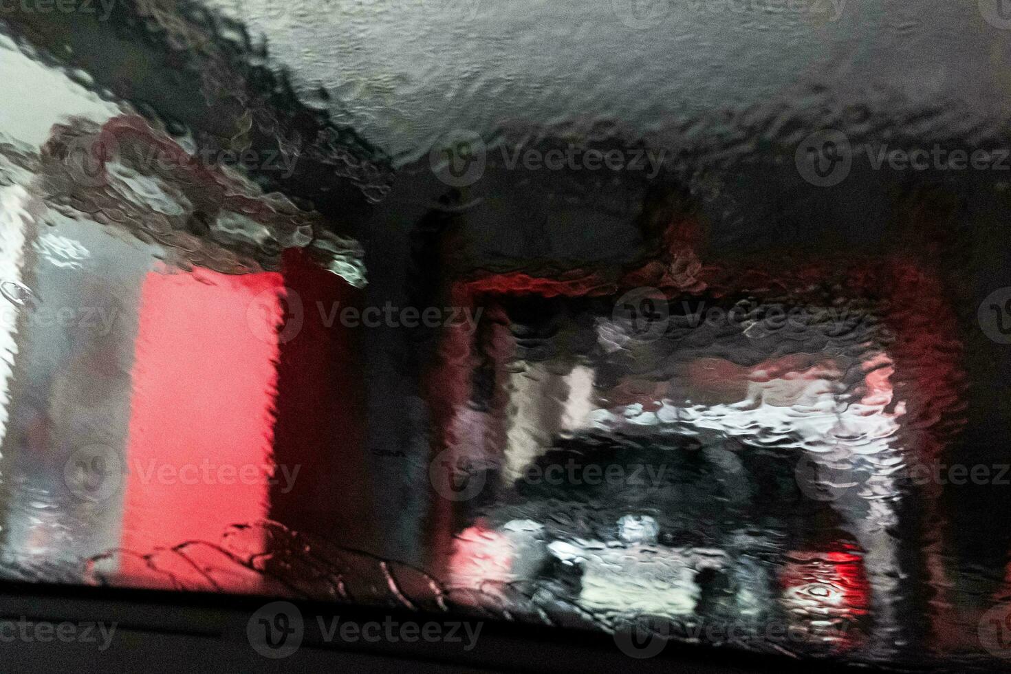 Water in carwash splashing on car window photo